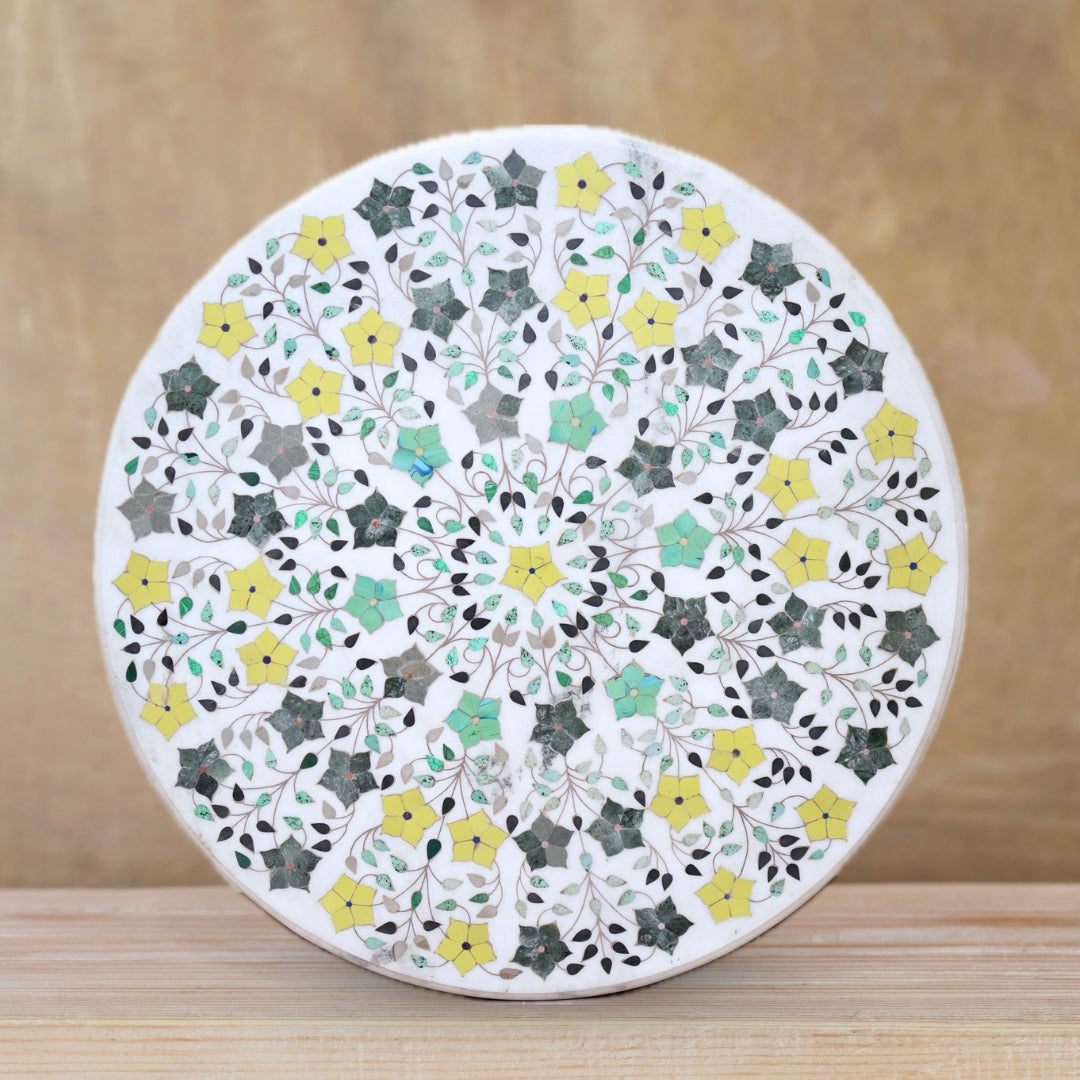 Handcrafted white marble table top featuring gemstone inlay