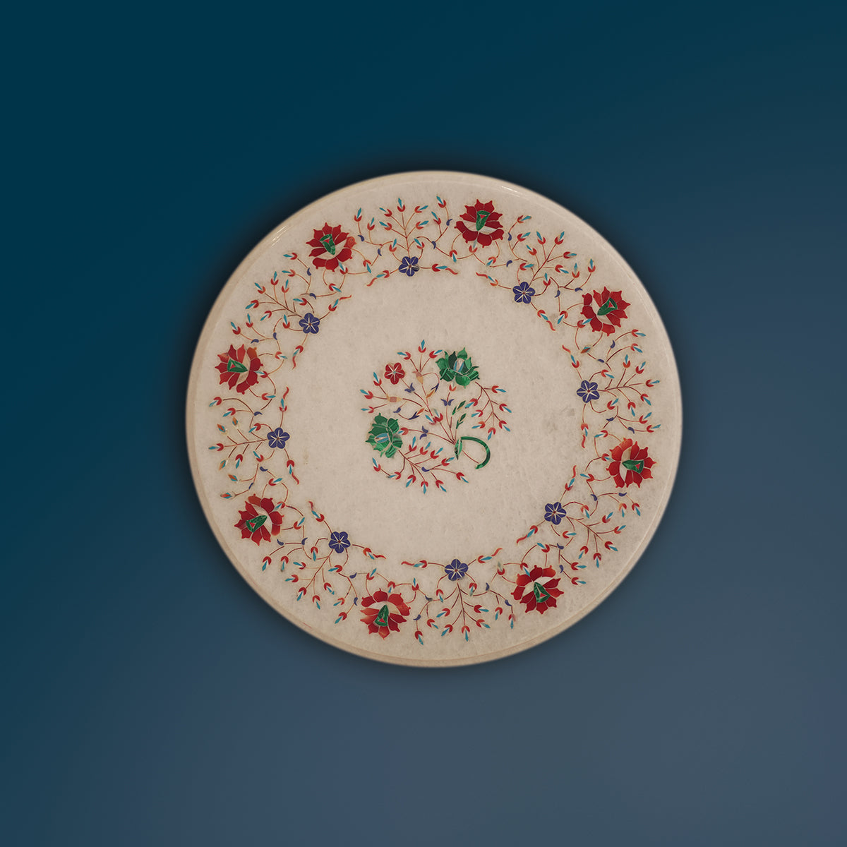 White marble table top with floral gemstone inlay patterns