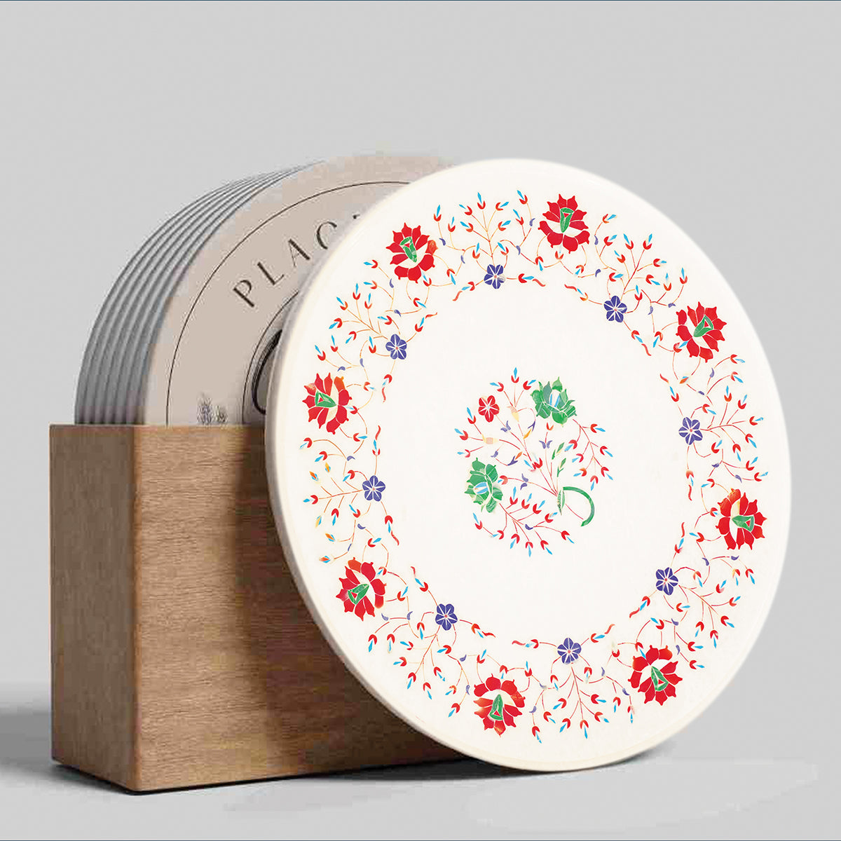 White marble table top with floral gemstone inlay patterns