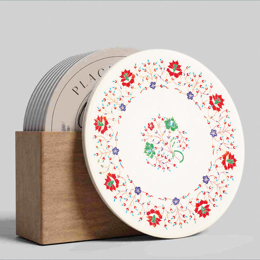 White marble table top with floral gemstone inlay patterns