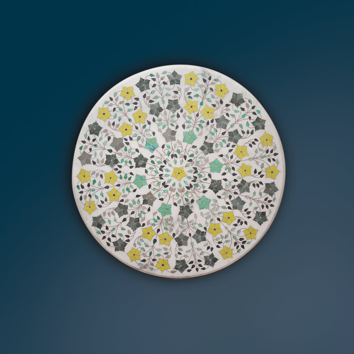 Handcrafted white marble table top featuring gemstone inlay